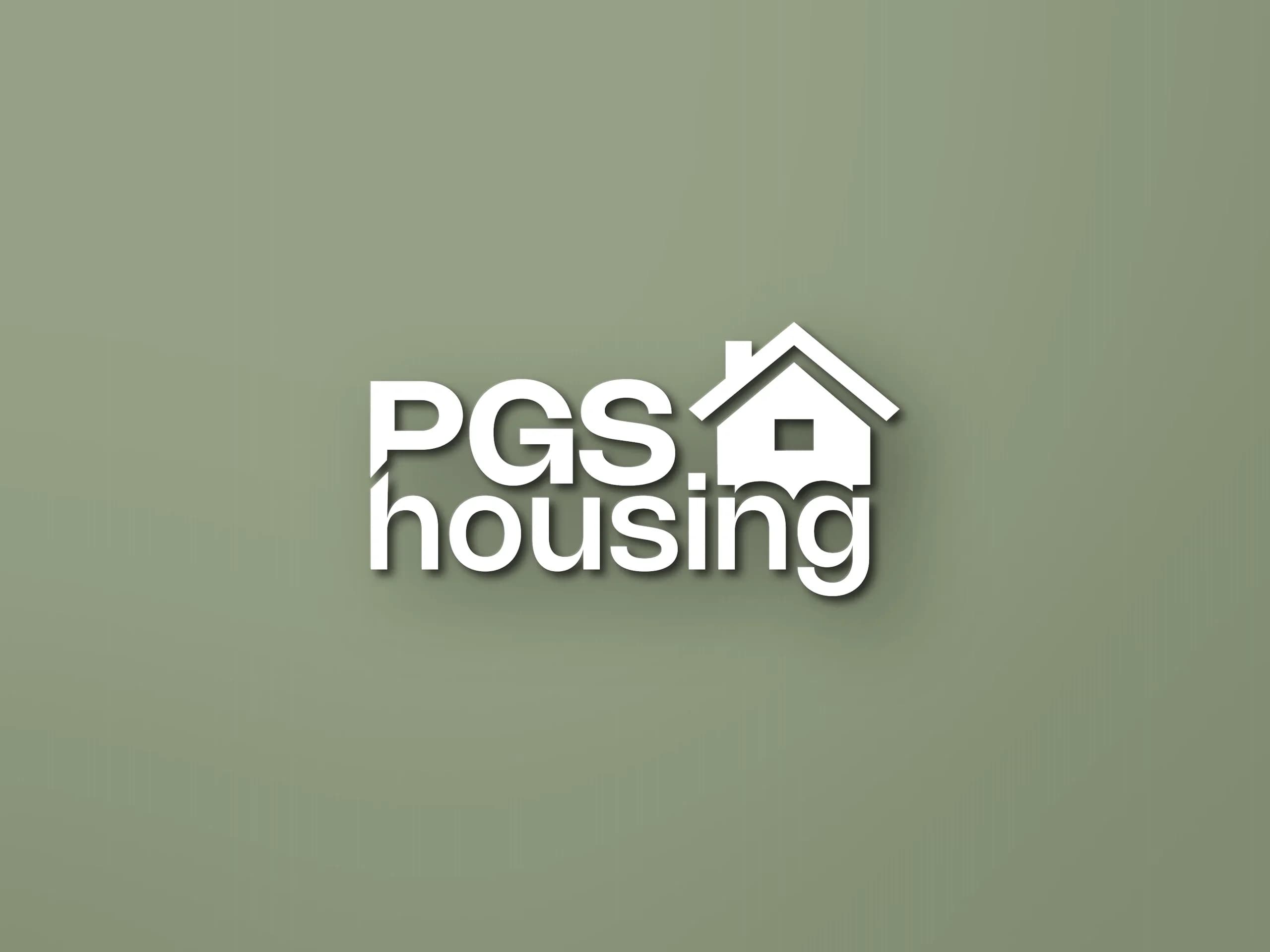 Het logo van PGS Housing als opliggende letters op een saliegroene wand